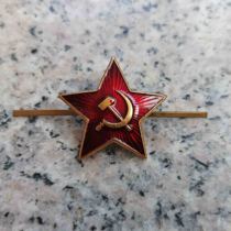 The Soviet Red Armys red five-pointed star cap badge is flawed