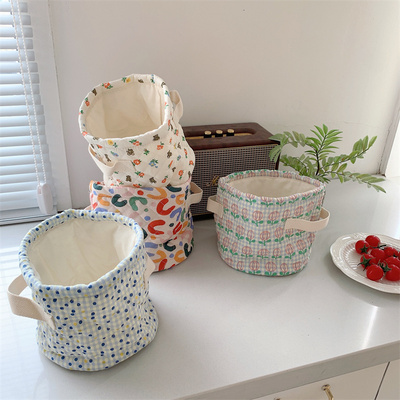 taobao agent Little white rabbit storage basket cute fabric 绗 gap, round barrel hand -raising the storage layer of the desktop cosmetics debris basket