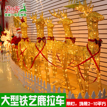 Christmas decorations glowing Christmas deer large wrought iron ornaments mall window Santa Claus deer carts flash
