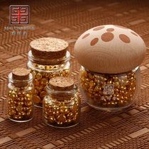 A bottle of golden beans a glass bottle of golden beans a small bottle of small golden beans a wishing bottle an exquisite empty bottle and a small