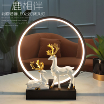 A deer accompanies the bedroom net red deer decorative wall lamp Simple modern creative decoration living room romantic table lamp