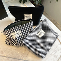 Cosmetic bag female large capacity portable black and white plaid hipster storage bag net red ins Wind storage bag wash bag