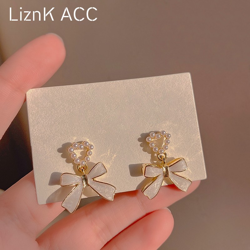 S925 Silver Needle Unique Pearl Bow Ear Studs 2022 New Trendy and Popular Design Sense High Grade Earrings for Women