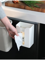 On the wall the tissue holder is attached to the wall. The tissue box is stained with the wall. The paper box is firmly fixed.