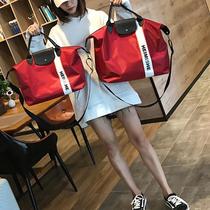 Korean fashion luggage bag travel bag female light waterproof trendy mens hand shoulder sports swimming fitness bag