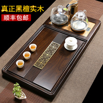 Whole ebony tea table Solid wood tea tray Kung Fu tea set Household living room automatic integrated with electromagnetic stove