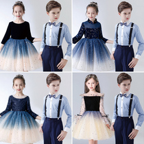 Childrens big choir acting out of the boy host poetry recitation of primary and secondary school girls fluffy gown dresses