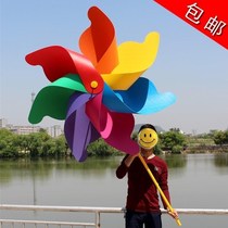 Windmill new iron rod colorful wooden rod stall rotating children green leaves color wooden rotating hand holding large three