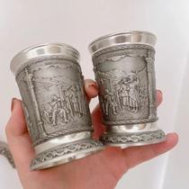 (Grandpa Canal) A pair of carved tin cups